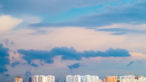 Clouds over Summer City Rooftops