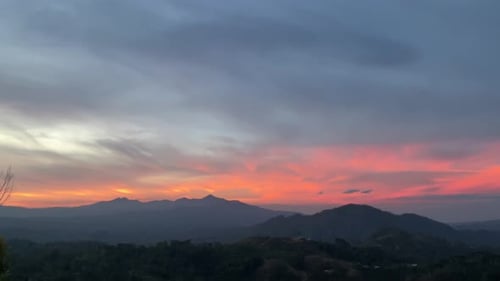 Beautiful Mountain Range Sunrise with Orange Clouds