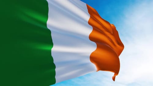 Realistic Irish Flag Waving Against Blue Sky