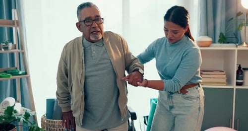 Woman, physiotherapist and helping wheelchair patient with walking or movement at the clinic