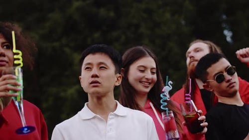 Group of Friends Celebrating Outdoors with Drinks