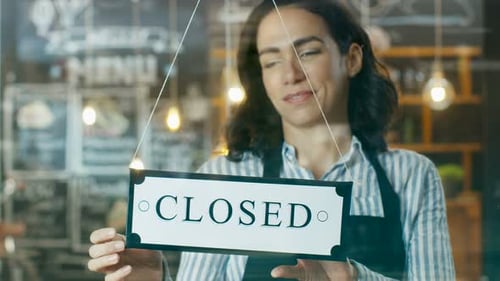 Beautiful Young Cafe Owner Turning Storefront Sign From Close to Open and Welcoming Her New Custome