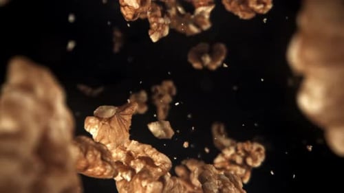 Shelled Walnuts Falling in Slow Motion