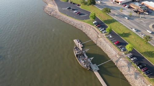 Aerial boomerang shot of the Pinta replica, revealing the Cumberland River and Clarksville, Tennesse