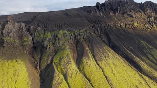 Aerial view of moss-covered volcanic mountains, perfect for nature, travel, and geology themes