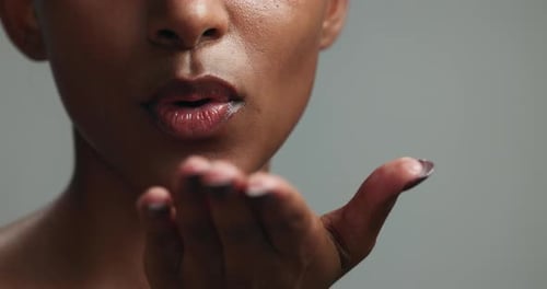 Beauty, kiss and makeup with lips of woman in studio for cosmetics, lipstick and flirting