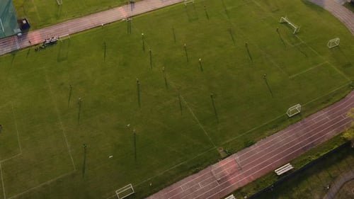 Aerial View of Soccer Practice on Green Field