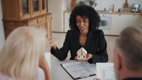 Presentation of Real Estate Woman Broker Talking with Clients Discuss Project African American Lady