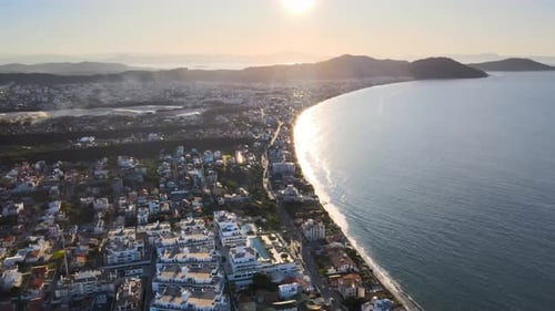 Aerial drone scene from hight sunset seen from above with paradisiacal beach and mountains in floria