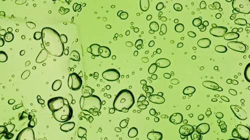 Abstract Green Liquid With Bubbles Close Up