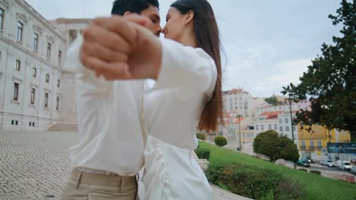 Happy Lovers Spinning Street Closeup. Latina Carefree Couple Holding Hands Swirling On