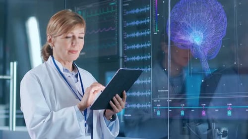 Female Scientist Uses Tablet Computer In the Modern Brain Study Laboratory and Monitors EEG Reading