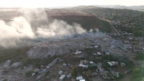 Rotating drone shot capturing a thought-provoking scene in South Africa. Vast expanse reveals waste