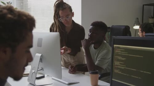Software Specialists Working in Team in Office