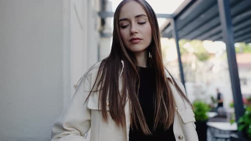 Stylish Woman Posing in Urban Environment