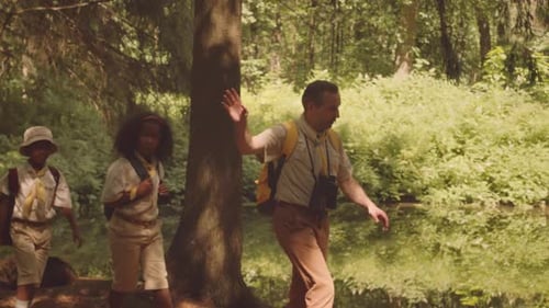 Scout Team Hiking at Forest in Summer