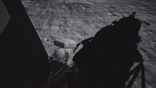 Astronaut Descending Lunar Ladder on Moon Surface