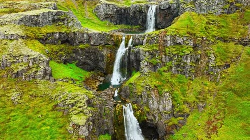 Wispy Waterfalls Flowing Over Cliff Mountain River Falling Over Cliff Creating Many Waterfalls with