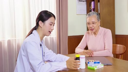 Professional therapist doctor explaining medication usage prescription using pill to her customer, f