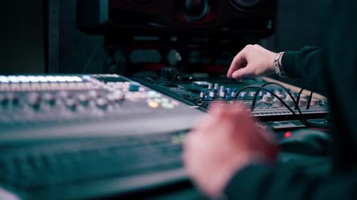 Close Up in the Recording Room Dark with Neon Lighting in the Studio the Sound Engineer Works at the