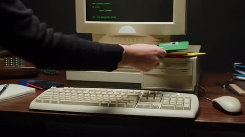 Using Diskette FDD for Old Computer Closeup Hand Inserting and Ejecting Floppy Disk Into Vintage PC