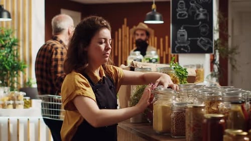 Woman in Shop Using Biodegradable Jars