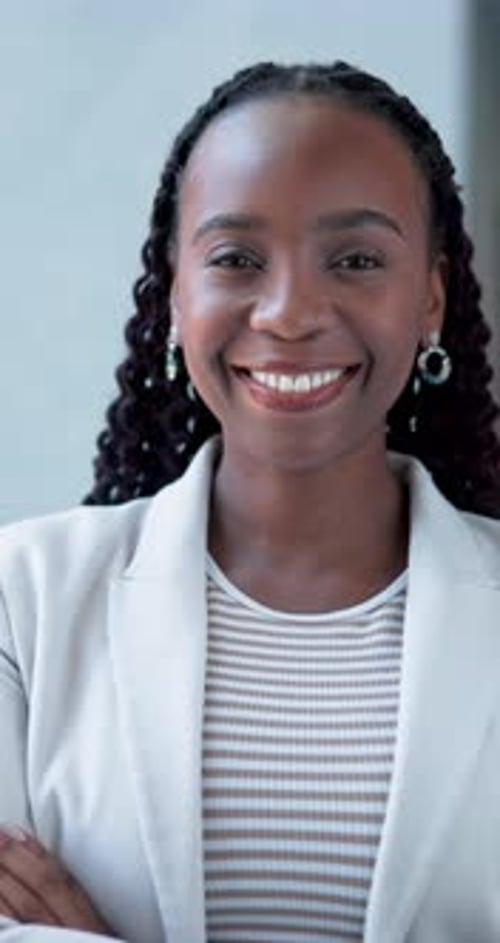 Smile, arms crossed and face of black woman in office for confidence, real estate broker