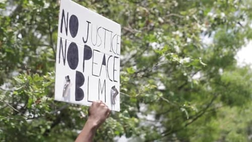 Black Lives Matter Protest Sign, Close Up, No Justice No Peace, Slow Motion