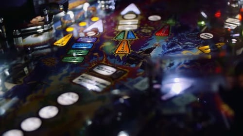 slow motion pinball machine with blue lights