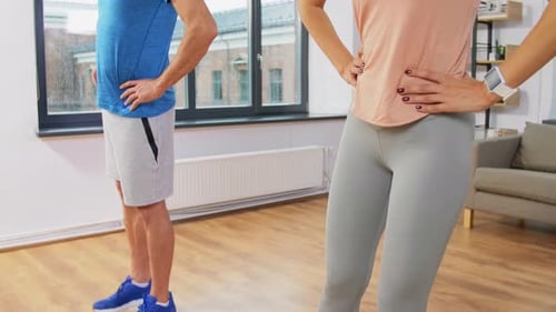 Sport, Fitness, Lifestyle and People Concept - Smiling Man and Woman Exercising