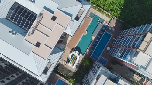 Aerial View Luxury Complex With Azure Pool and Water Slides for Kids on the Mediterranean Shore