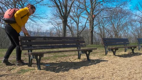 Female Find a Lost Phone in the Park