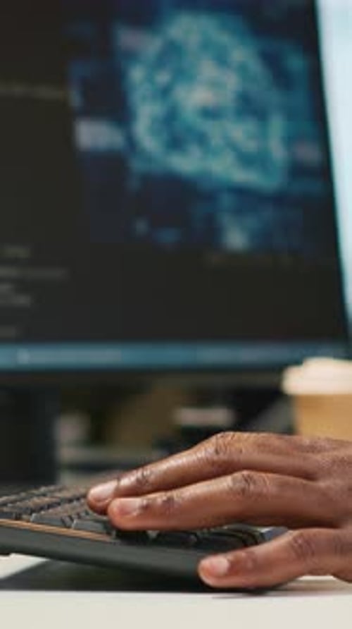 Vertical Video Technician Using Mockup Laptop Next to Office Coworkers Developing Applications
