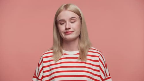 Pensive Blond Woman in Striped Shirt Close Up