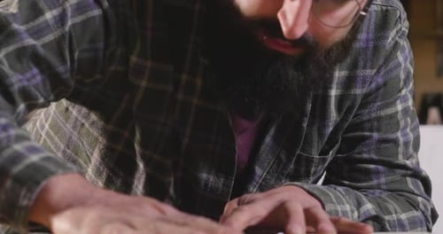 In his laboratory, a liutist builds high quality guitars for musicians, working fine wood. Concept