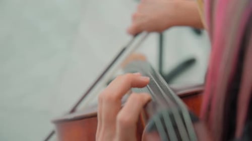 Close Up View of Woman Hand Playing Cello Orchestra Musicians Instruments
