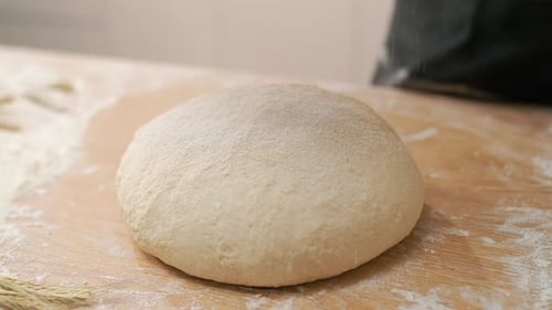Ball of Dough is Sprinkled with Flour