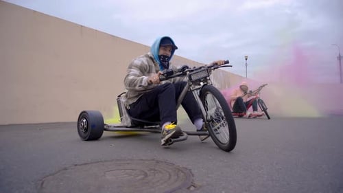 Young Adults Drift Trike on Urban Street