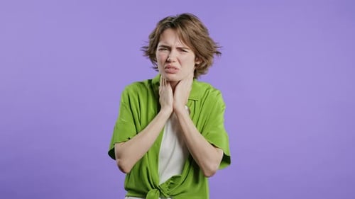 Pretty Woman Has Sore Sick Lady with Swollen Throat on Violet Studio Angina Young Girl Feels Pain