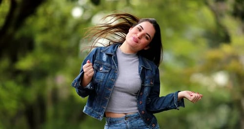 Young Woman Cheering and Celebrating in Nature