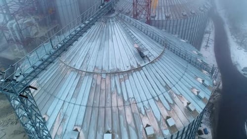 Aerial View of Rural Grain Silos on Foggy Day