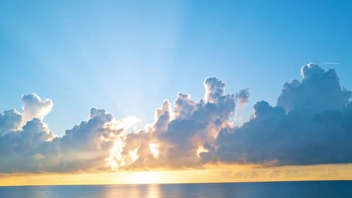 Beautiful Golden Sky and Cloudscape Over Ocean Horizon