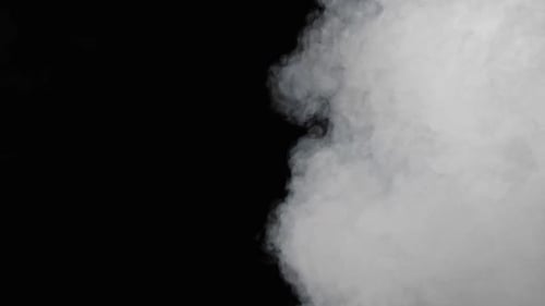 White Smoke Billowing on Black Background