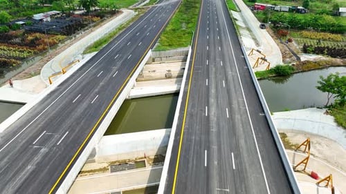 Drone aerial view above new intercity motorway without car.