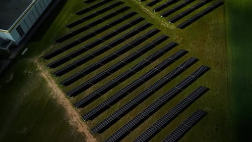 An Expansive Aerial View Captures a Solar Farm Adorned with Numerous Solar Panels Spread Across a