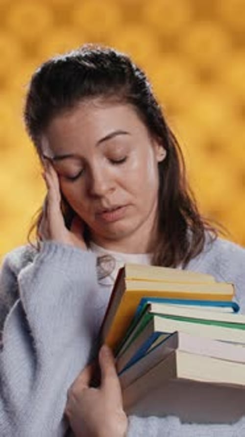 Vertical Video Woman Feeling Migraine Pain From Textbooks Needed for Homework