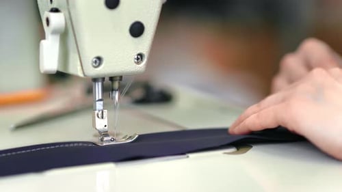 Female Seamstress Hands Sews Textile Tissue Use Electric Sewing Machine Clothes Production Closeup