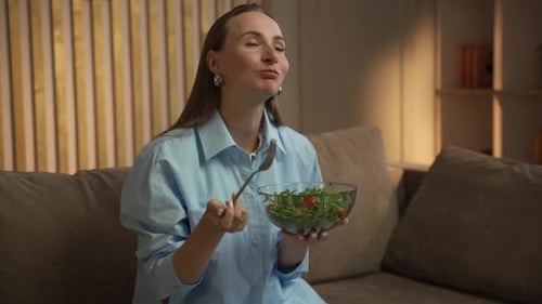 Woman Eats Healthy Salad in Home Interior