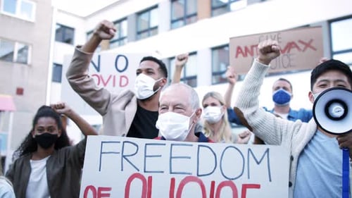 People demonstrate for rights and freedom holding placards in the city