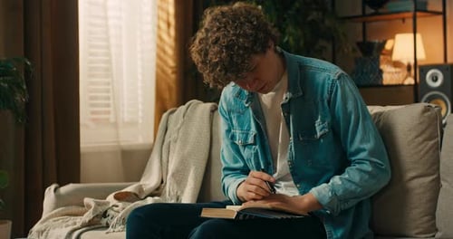 Lucky Student Who Writes and Sticks Cards with English Names of Objects on Things in the Living Room